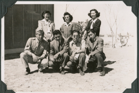 Four men and three women posing outside barracks (ddr-ajah-2-557)