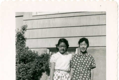 Two girls outside house (ddr-densho-430-199)