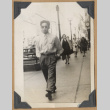 Man walking down the street (ddr-densho-542-129)