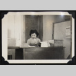 Nori behind a desk (ddr-densho-542-691)