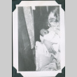 Photo of a woman holding a baby (ddr-densho-483-1287)