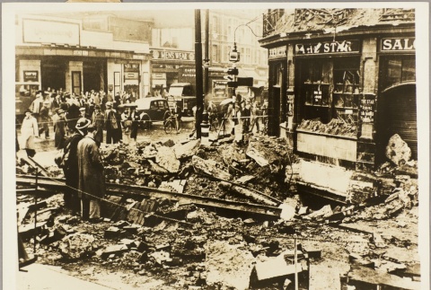 A crowd examining damage from a bombing (ddr-njpa-13-259)