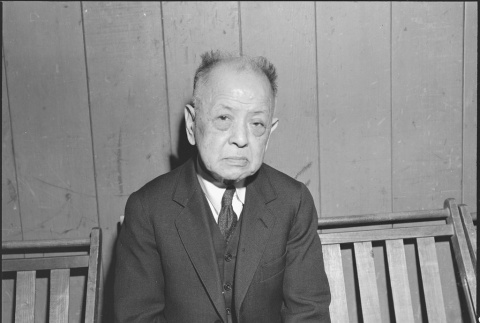 Issei man waiting to register for mass removal (ddr-densho-151-237)