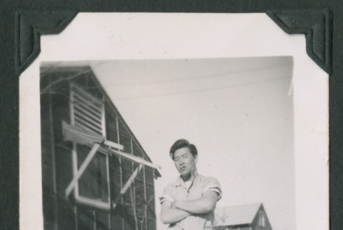 Man standing with arms crossed (ddr-densho-471-50)