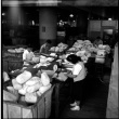Four people packing items for shipping (ddr-densho-426-949)