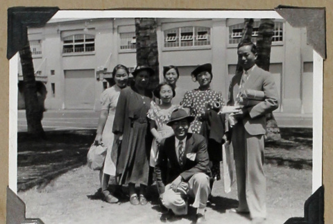 Group photograph outside a building with open windows (ddr-densho-404-250)