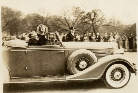 Franklin D. Roosevelt waving from a car (ddr-njpa-1-1527)
