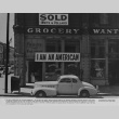 I am an American sign on the store front on December 8, 1941 (ddr-csujad-7-1)