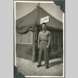 Soldier in front of tents (ddr-densho-201-534)