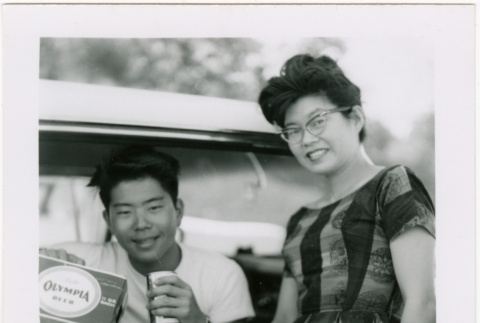 Tomoye (Nozawa) Takahashi and Norman Takahashi by car (ddr-densho-426-2204)