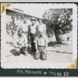 Four men and a woman standing outside barracks (ddr-densho-434-361)