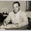 Man posing at his desk (ddr-njpa-2-934)