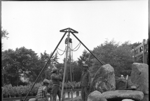 Three men setting boulders at D. Hill Nursery (ddr-densho-377-1422)