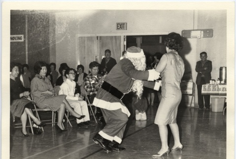 Santa dancing with an adult (ddr-jamsj-1-569)