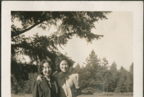 Two women standing in a meadow (ddr-densho-316-73)