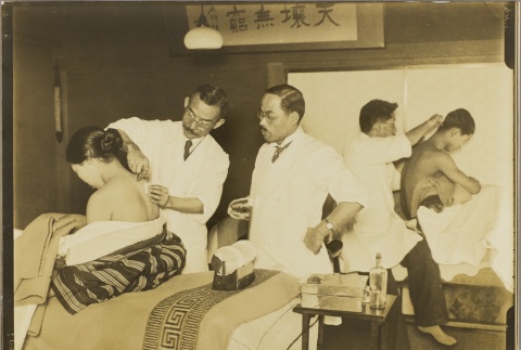 Physiotherapist Fujii at work (ddr-njpa-5-1056)