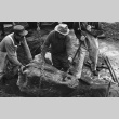 Fujitaro Kubota, Tom Kubota and assistant setting stone, Seattle University (ddr-densho-354-2084)