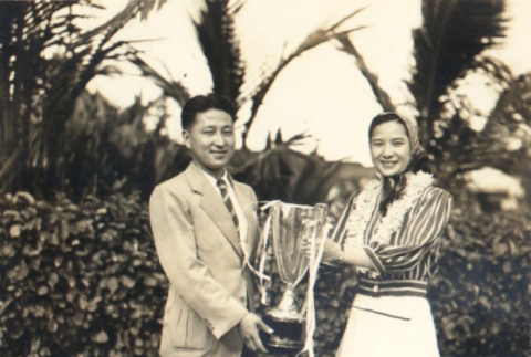 Takiko Mizunoe and a man holding a trophy (ddr-njpa-4-736)
