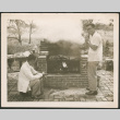 Two men grilling (ddr-densho-293-134)