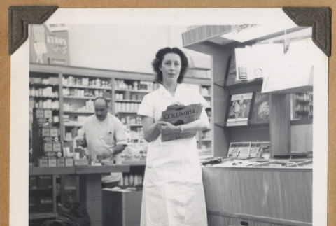 Woman holding music records (ddr-densho-542-115)