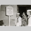 Miss Hawaii and two men in Navy dress whites reading Washington Monument sign (ddr-njpa-2-836)