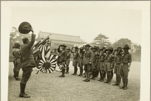 Japanese Boy Scouts and adult leaders saluting flags (ddr-njpa-13-1188)