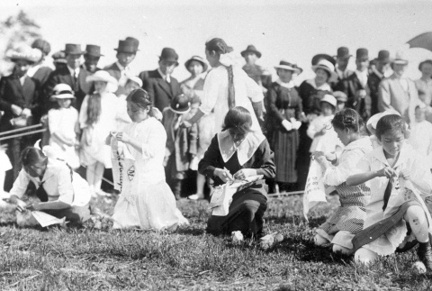 Children playing a game at a community picnic (ddr-densho-13-12)