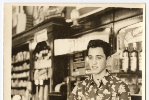 Man working behind a counter (ddr-densho-542-802)