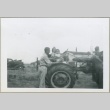 Two girls riding a tractor (ddr-densho-300-140)