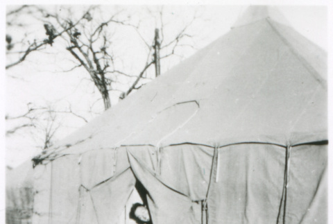 Soldier peeking out of tent (ddr-densho-1007-865)