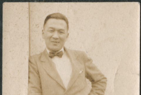 Man leaning on building (ddr-densho-523-10)