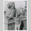 Takeo Isoshima with lion statue (ddr-densho-477-138)