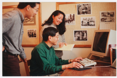Office photo of Becky Fukuda and computer (ddr-densho-506-10)