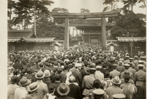 A large crowd walking through the entrance of a shrine (ddr-njpa-8-46)