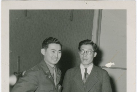 Ted Akimoto standing with another man (ddr-densho-299-1)