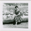 Tomoye (Nozawa) Takahashi sitting on log (ddr-densho-426-2198)