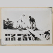 Two construction workers atop a beam (ddr-densho-433-682)