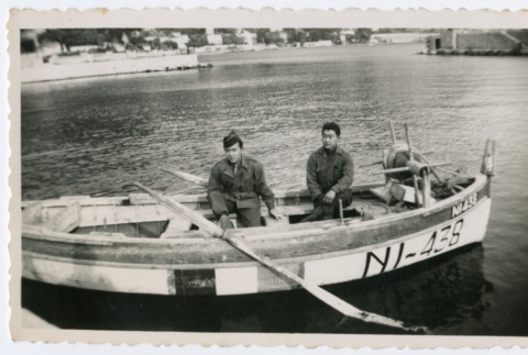 Two soldiers in rowboat on water (ddr-densho-368-75)