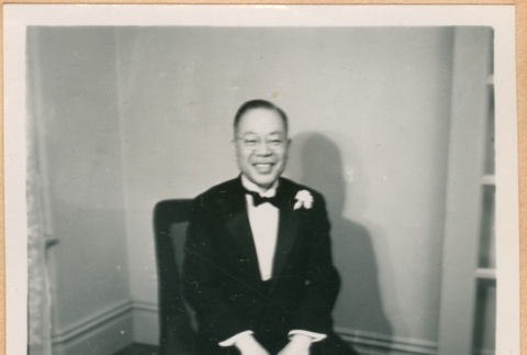 Unidentified man, seated and smiling (ddr-densho-410-542)