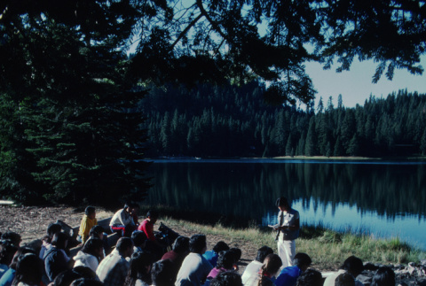 Campers listening to a talk on the lakefront (ddr-densho-336-1465)
