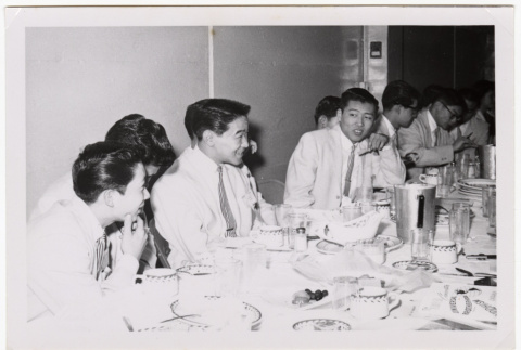 Skyliners band members sit at a banquet table (ddr-sbbt-3-157)