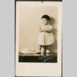 Young girl with birthday cake (ddr-densho-316-195)