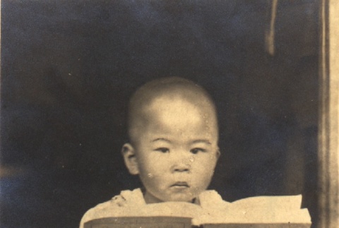 Young boy with a book (ddr-njpa-4-2317)