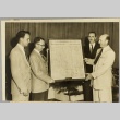 J. Q. Adams presenting a historical document to J. Frank McLaughlin (ddr-njpa-2-3)