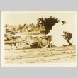 Soldier taking cover near a tank (ddr-njpa-13-820)