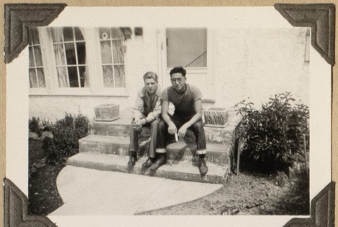 Roy Sumida and another man seated on steps (ddr-densho-542-457)