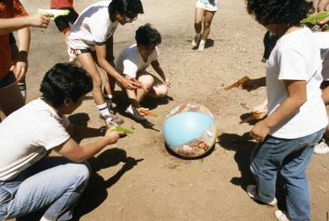 Campers moving a balloon with water guns (ddr-densho-336-1590)