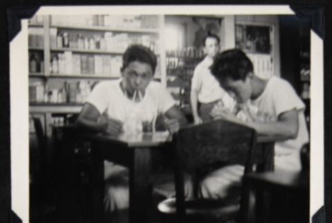 Smokie drinking from two cups (ddr-densho-542-612)