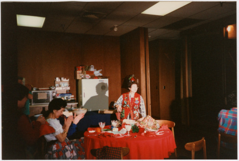Tomoye Takahashi standing behind table (ddr-densho-426-1296)