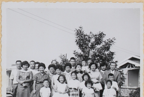 Large group of men, women and children in yard outside house (ddr-densho-522-56)
